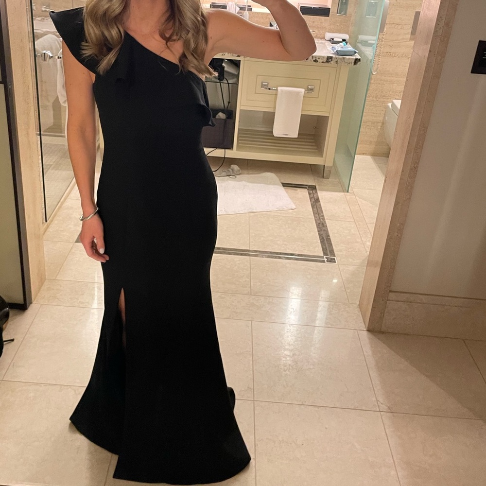 Likely black one shoulder ruffled gown